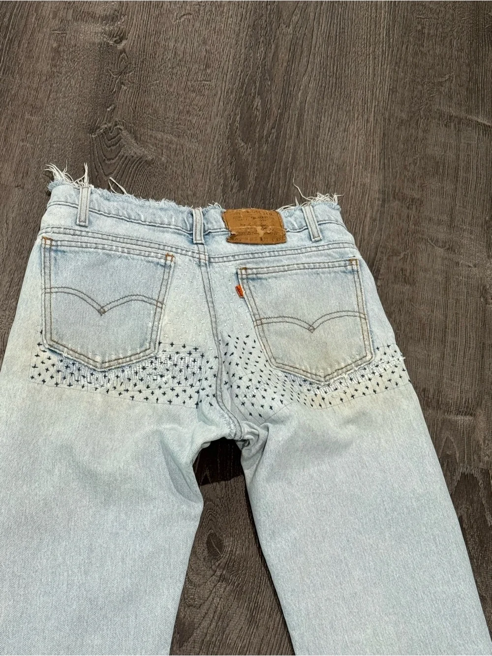 Vintage orange tab Y2K Light Blue Distressed Men’s Jeans with Patch Detail